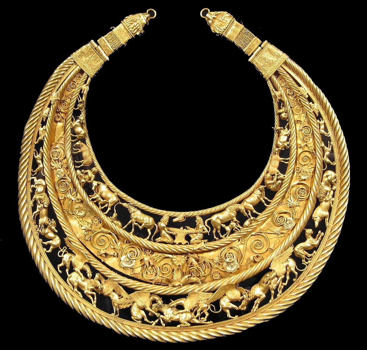 Gold pectoral necklace from ancient Scythia. Ornamental depictions of wildlife. Bible.