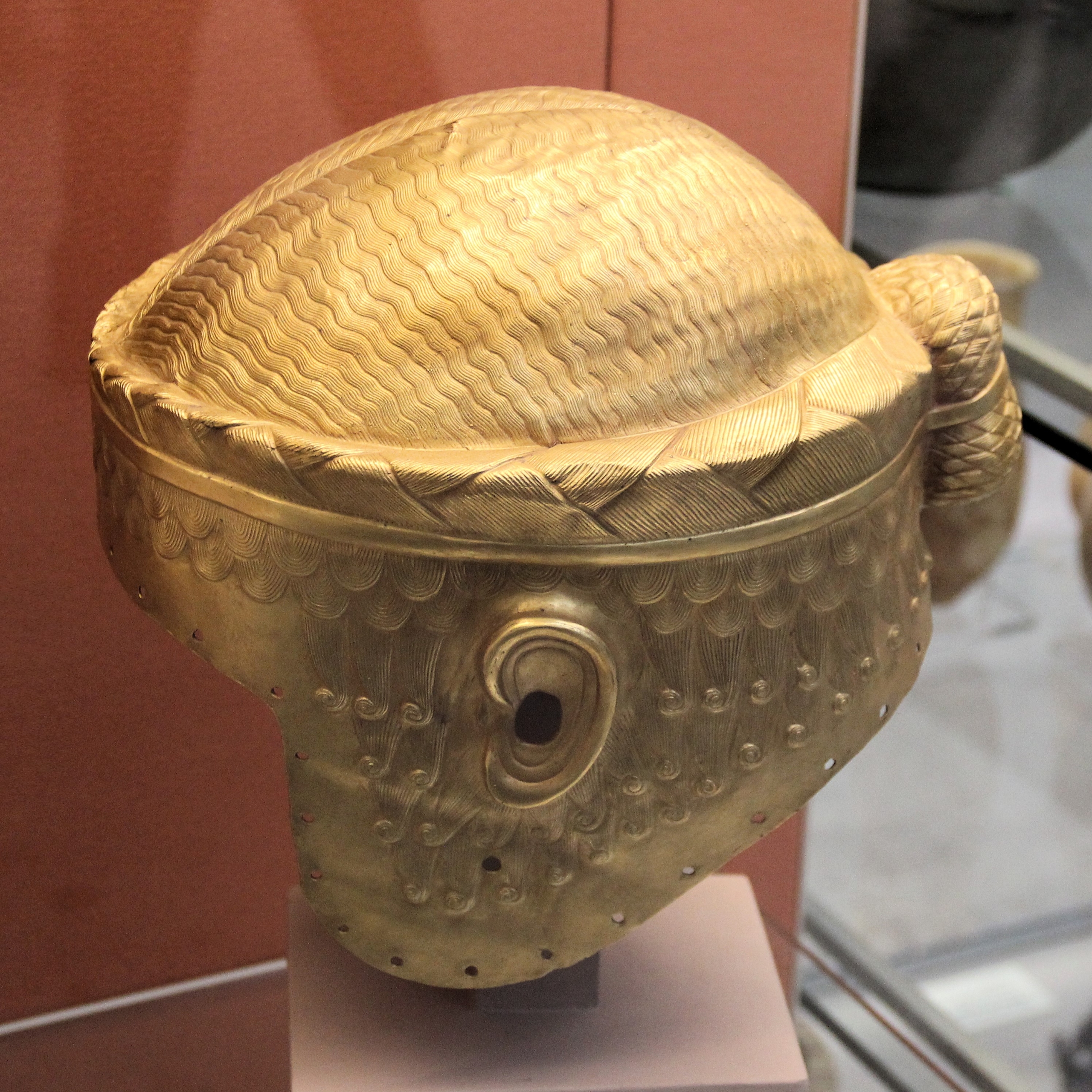 Gold helmet from ancient Sumeria. Human head design. Salvation is a helmet.